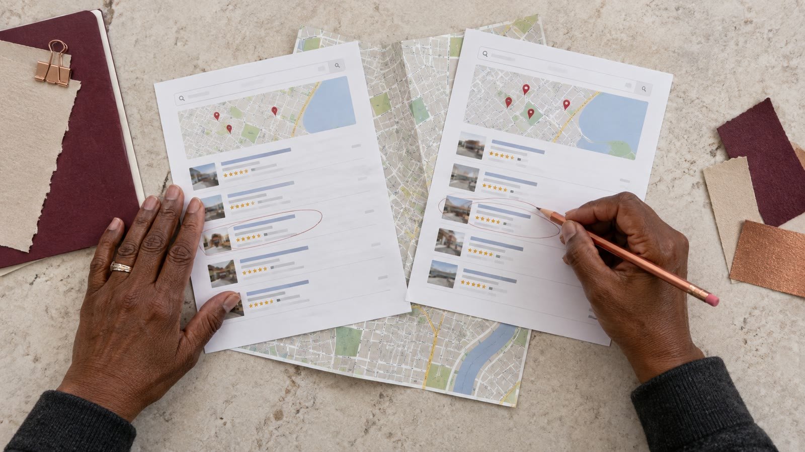 A marketer compares local search views beside a folded street map.